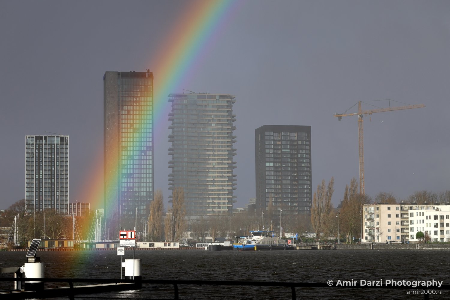 Amsterdam Rainbow over Urban Waterfront Noord Cityscape Fall Netherlands in Amsterdam Netherlands