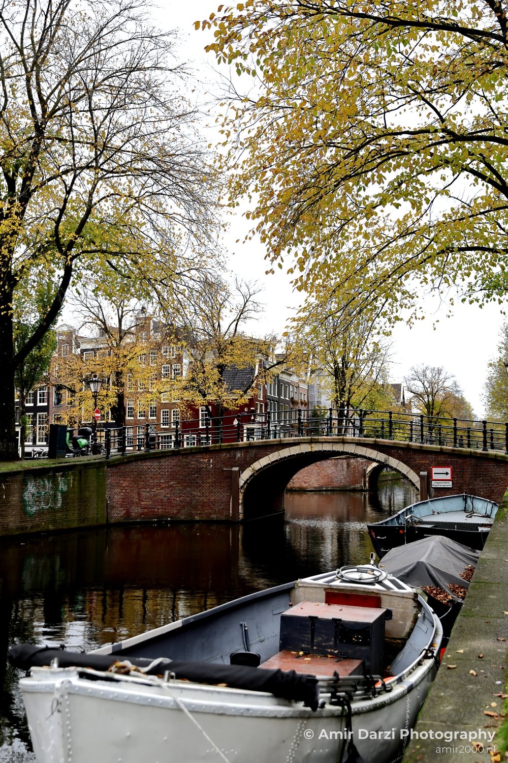 Binnenstad Riverside pathway autumn colors Amsterdam fall Urban Street Cityscape Netherlands in Amsterdam Netherlands