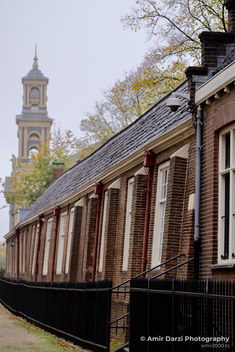 Clock tower distant view Amsterdam fall Urban Street Cityscape Netherlands in Amsterdam Netherlands