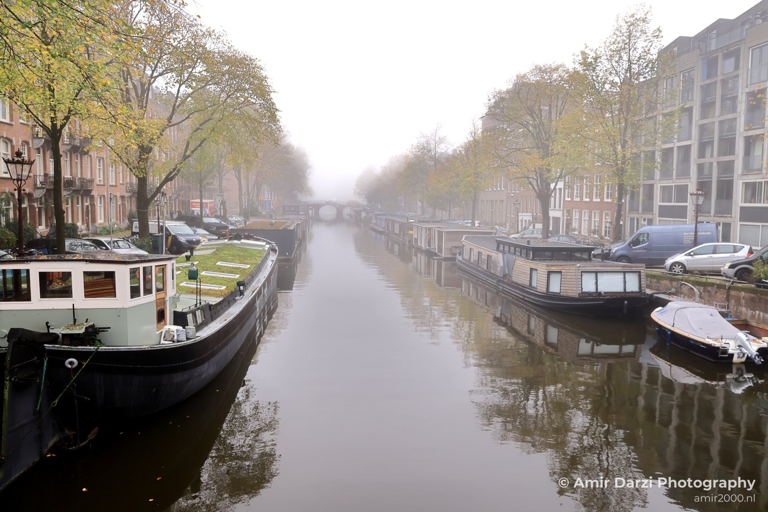 Foggy canal Amsterdam fall Urban Street Cityscape Netherlands in Amsterdam Netherlands