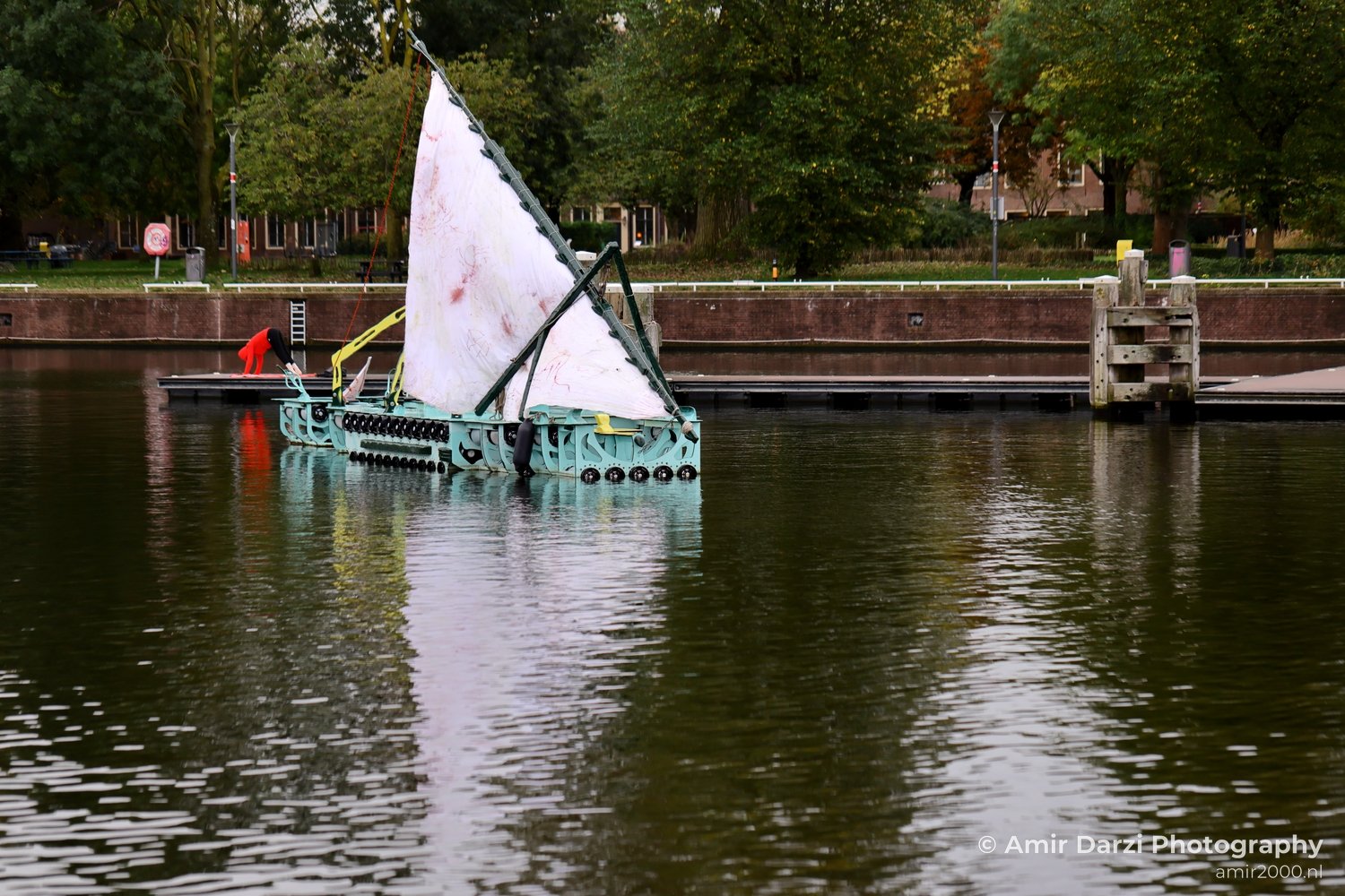 Marineterrein Sailboat bridge tranquil canal Amsterdam fall Urban Street Cityscape Netherlands in Amsterdam Netherlands