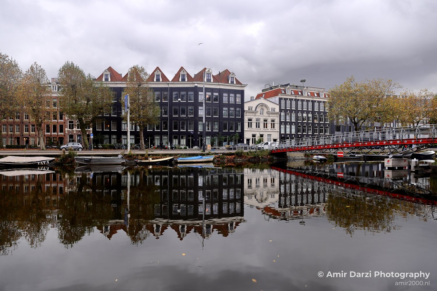 Mauritskade Rows of houseboats along canal Amsterdam fall Urban Street Cityscape Netherlands in Amsterdam Netherlands
