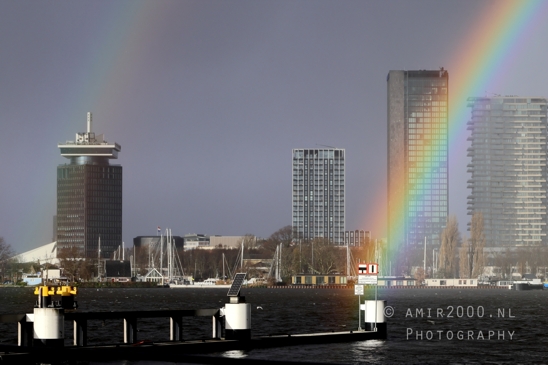 Amsterdam_Rainbow_Arching_Tall_Buildings_Noord_Urban_Scene_Fall_Netherlands_Cityscape_Photography_001_Canon_EOS_R5_Mark_II.JPG