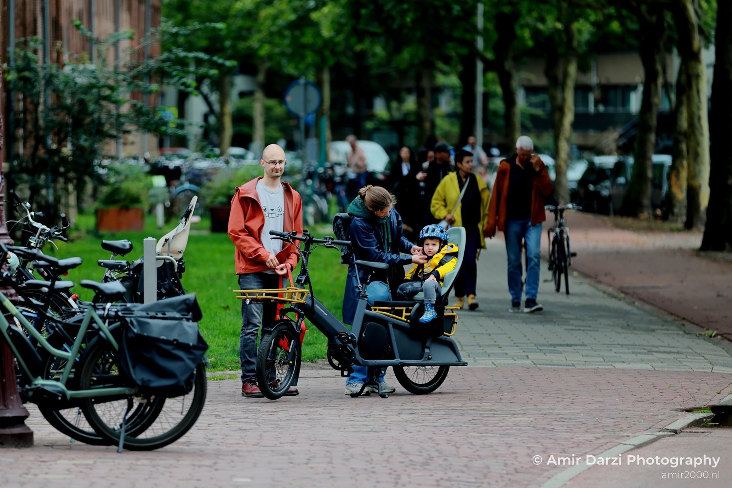 Family and bicycles in the city Amsterdam Netherlands People Creative from People Creative Collection series