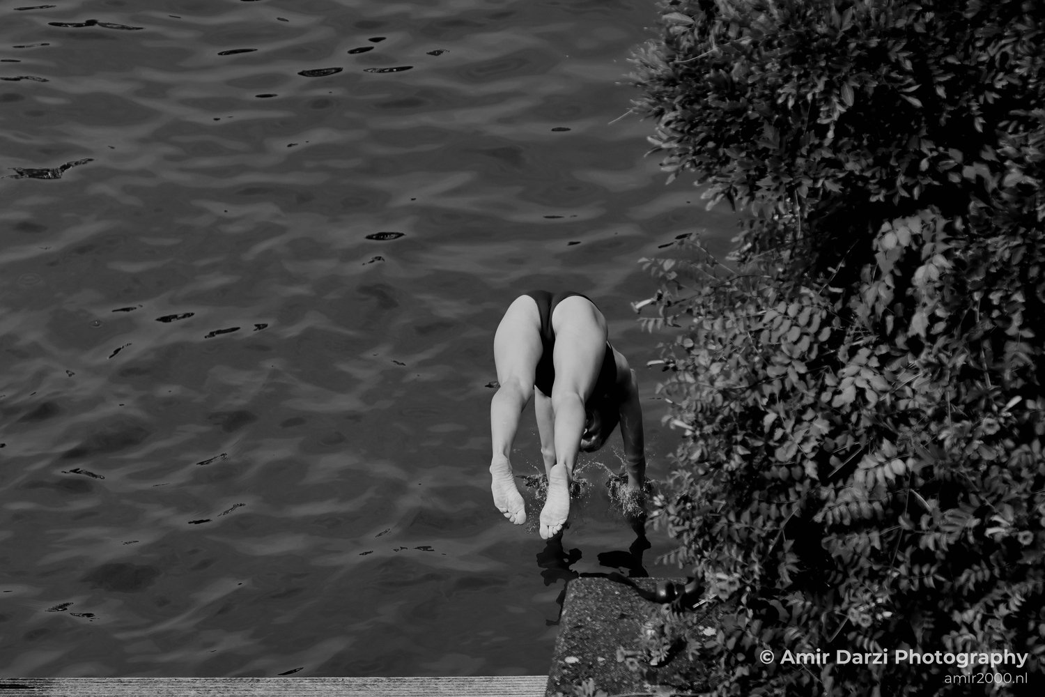Jumping to the canal Black and White in Amsterdam Netherlands from People Creative Collection series Photo 6