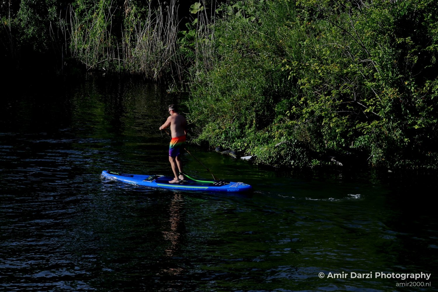 Man Relaxing On Surfboard summer scenery in the city Amsterdam Netherlands People Creative from People Creative Photo 5