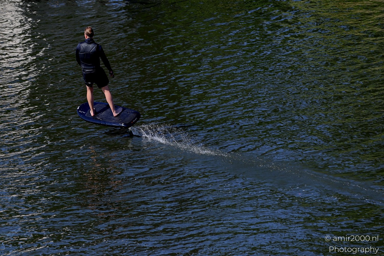 Man Surfing On Paddleboard in the Canal Amsterdam Netherlands People Creative from People Creative Collection series Photo 5