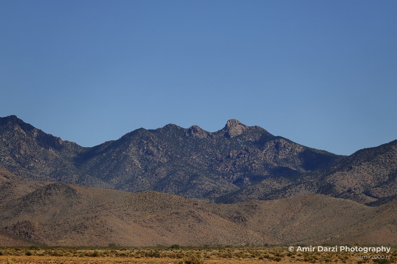 Desert Landscape Arizona A view of the western United States, featuring a mountainous region with clear
