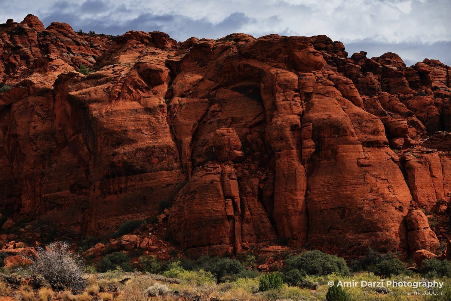 Rock-formation view of canyon landscape with sunlit rock surfaces and shadow detail in St George Utah.