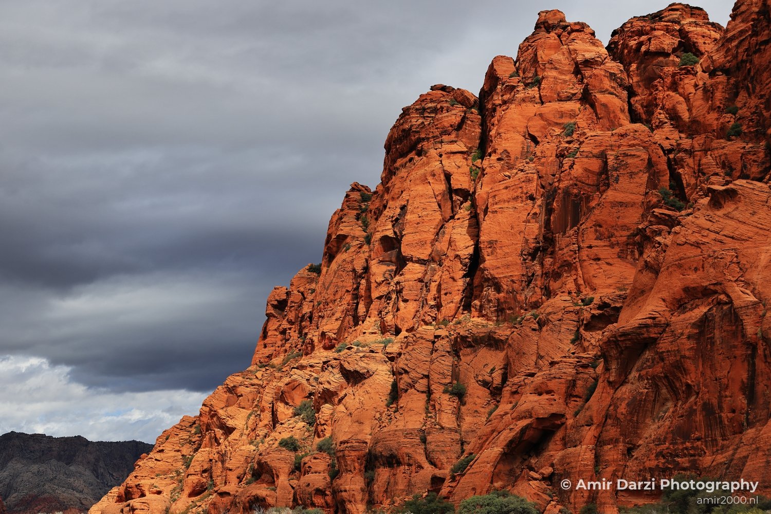 Sandstone terrain view of canyon landscape with canyon walls and dry ground texture in St George Utah.