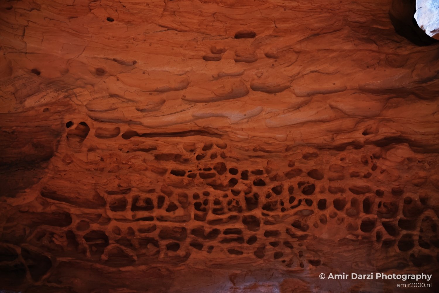 Dry-terrain view of canyon landscape with sunlit rock surfaces and shadow detail in St George Utah.
