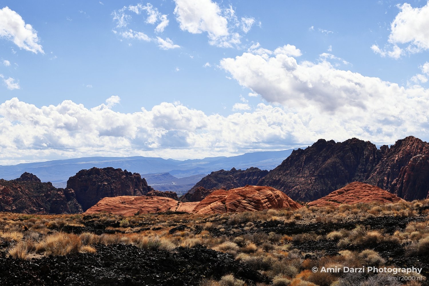 Dry-terrain view of canyon landscape showing weathered rock structure and depth in St George Utah.