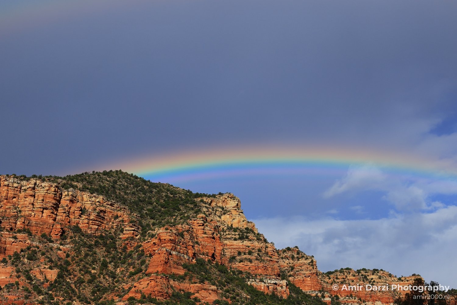 Morning Rainbow Over Bell Rock The morning sun casts a beautiful rainbow over Bell Rock in the heart