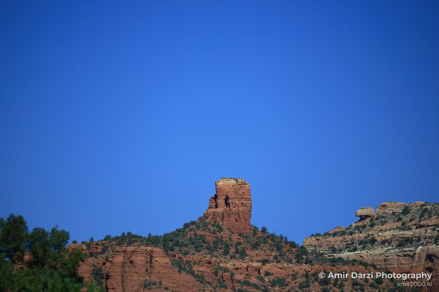 Red Rock State Park A towering red rock formation stands as a testament to the geological history