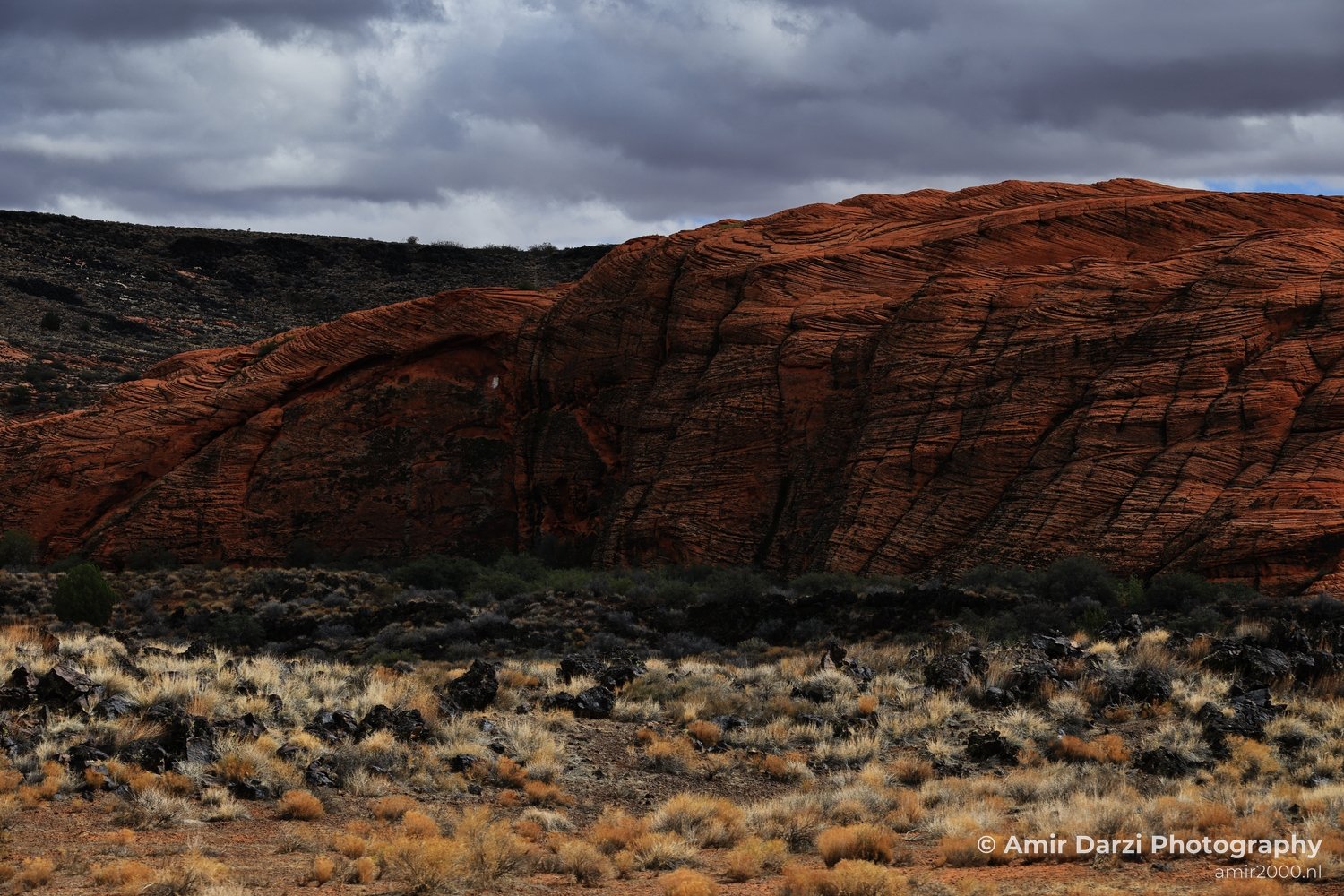 Arid-landscape view of canyon landscape showing desert horizon and exposed geology in St George Utah.