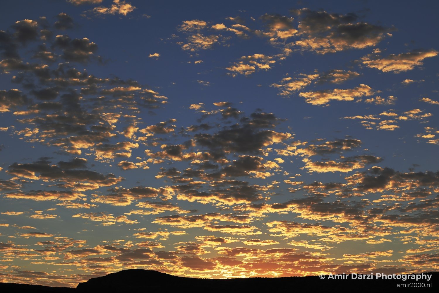 Sunrise in Bell Rock Loop Trail A picturesque view of the sunset with clouds reflecting light