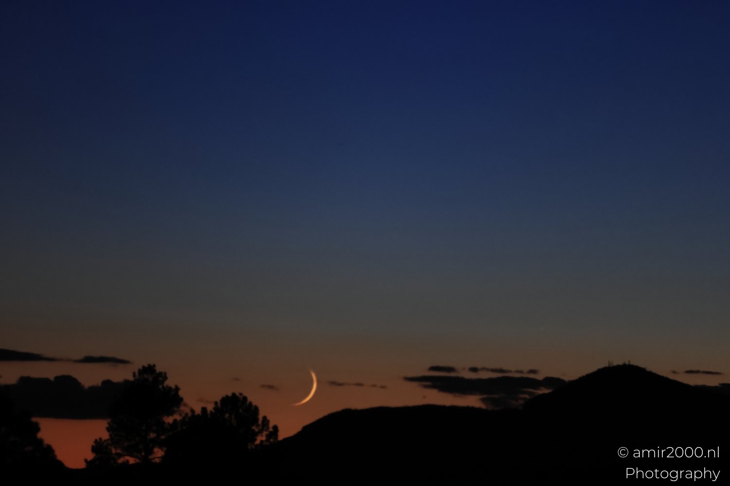 Sunset Over Mountains Between Flagstaff to Williams A crescent moon hangs in the sky above