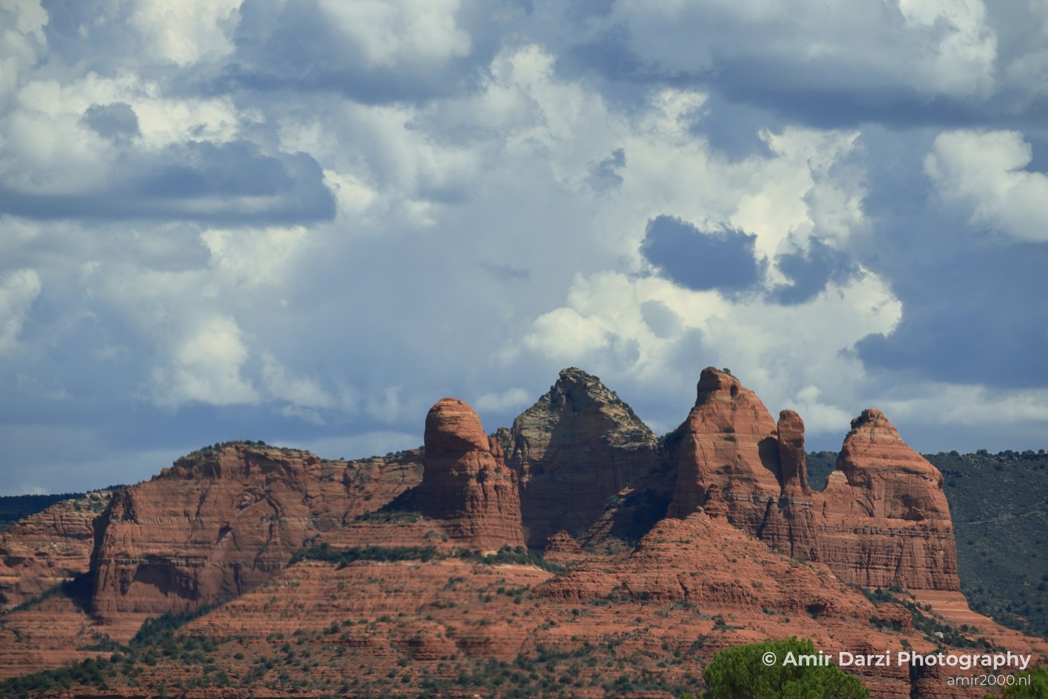 The amazing Red Rocks Red rocks of Sedona under a partly cloudy sky in Sedona Arizona USA