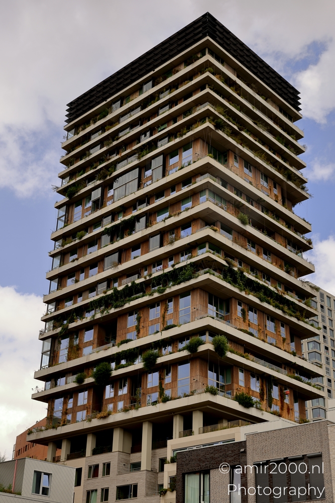 Vertical Sloterdijk full height view with layered balconies and planted terraces in Amsterdam