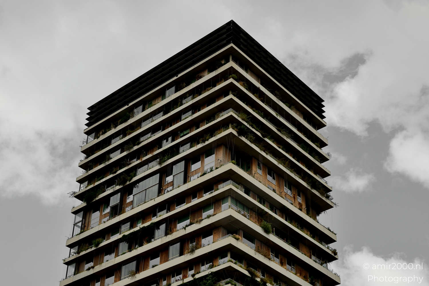 Corner detail of Vertical Sloterdijk with stacked terraces planters and cable trellises