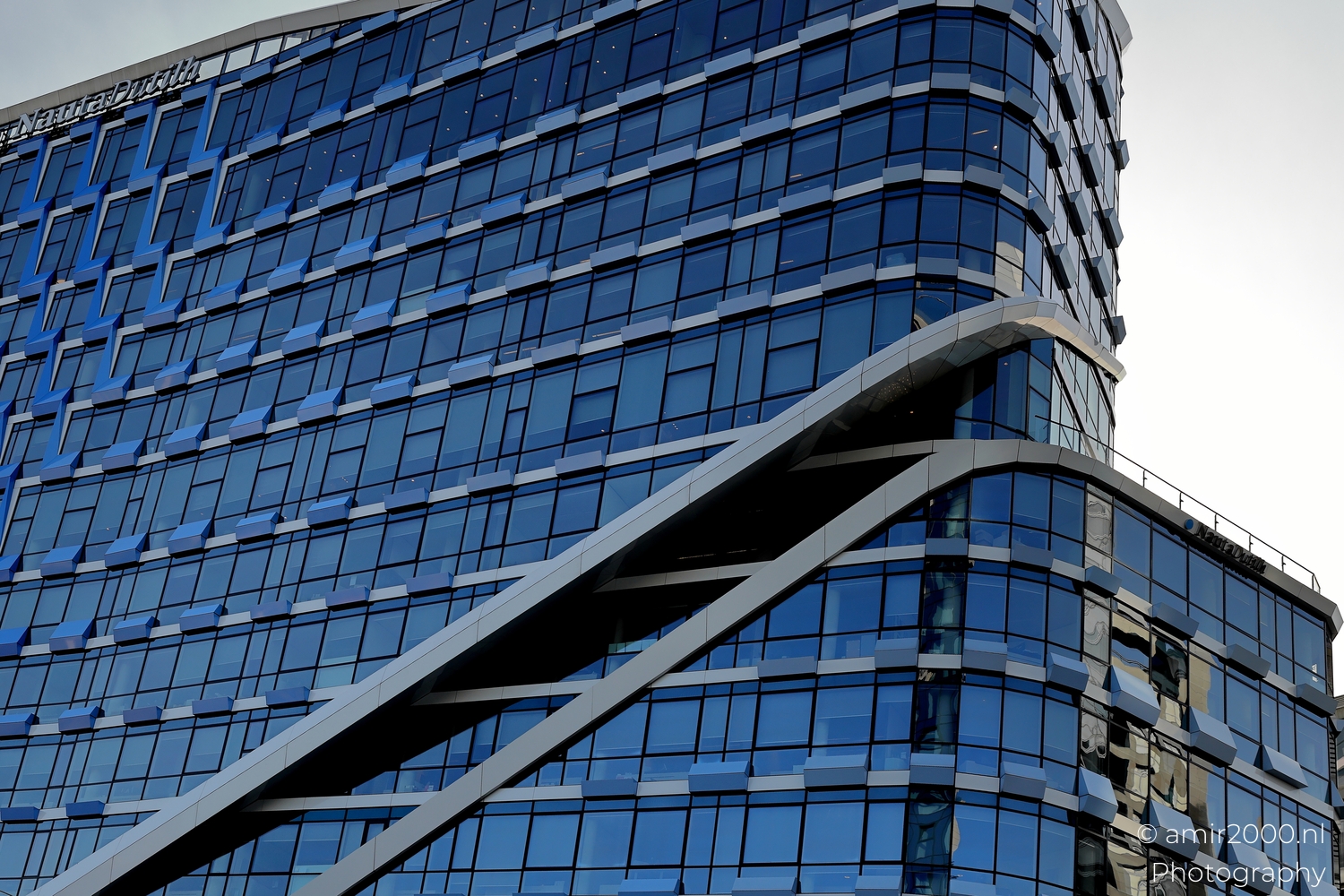 Close view of stepped glazing and fins on the NautaDutilh facade Zuidas Amsterdam