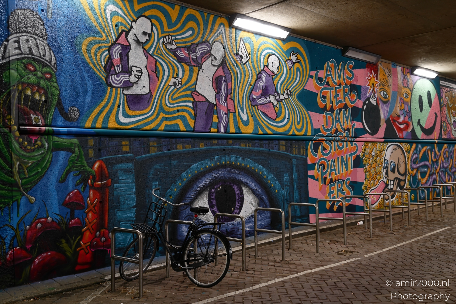 Psychedelic mural by Amsterdam Sign Painters with dancers, giant eye and parked city bike in tunnel