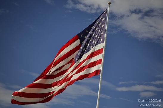 An shows storefronts and sidewalks while dense city architecture remains visible in Utah USA. - image from year 2025 #002