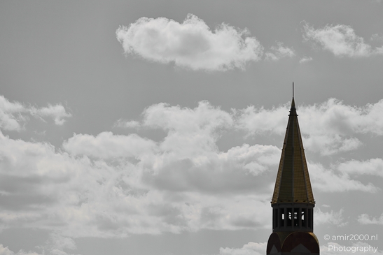 Against dense city architecture, an shows a town street with urban elements in Denver Colorado - image from year 2025 #006