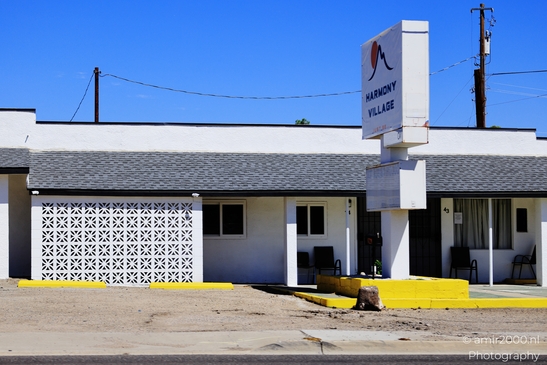 Small places on the go road trip in Arizona USA. A small motel in Arizona, with a clear blue sky - image from year 2025 #001