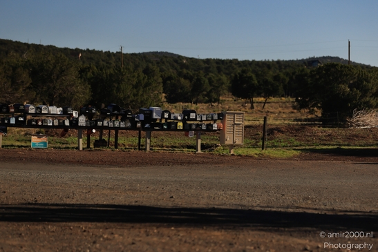 Small places on the go road trip in Arizona USA. A collection of mailboxes in a rural setting, - image from year 2025 #010