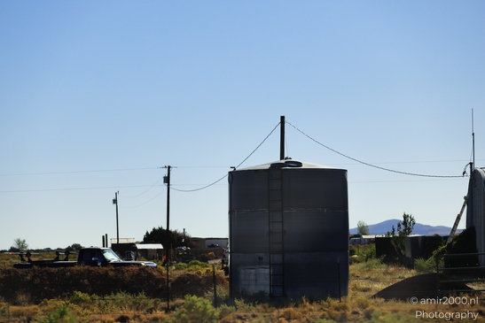 Small places on the go road trip in Arizona USA. A small building sits in a desert landscape, - image from year 2025 #011