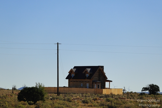 Small places on the go road trip in Arizona USA. A small cabin in a desert landscape, bathed in - image from year 2025 #012