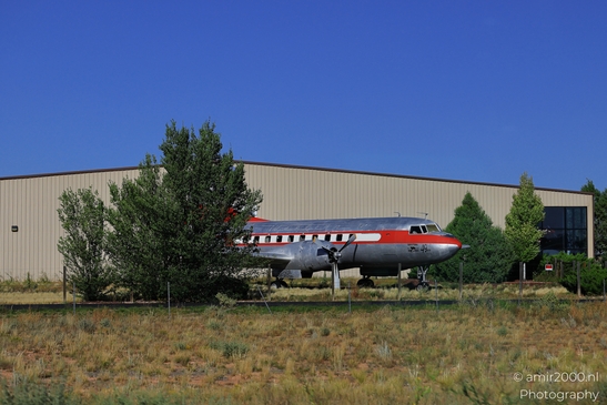 Small places on the go road trip in Arizona USA. A parked airplane in front of a building. - image from year 2025 #014