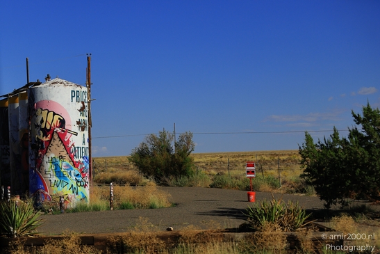 Small places on the go road trip in Arizona USA. A vibrant graffiti-covered water tank stands - image from year 2025 #023