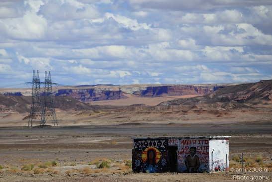 Small places on the go road trip in Arizona USA. A small shack in a desert landscape, with power - image from year 2025 #050