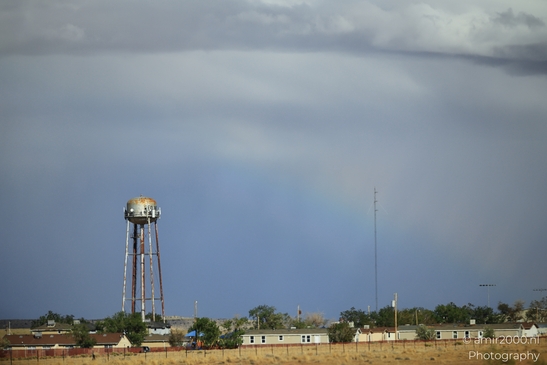Small places on the go road trip in Arizona USA. A rainbow arcs over a small town in Arizona, - image from year 2025 #059