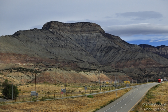 A highway running alongside a mountainous landscape in Colorado USA. - image from year 2025 #004