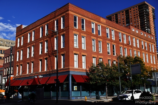 A red brick commercial building with a FedEx Office on its ground floor in Denver Colorado USA. - image from year 2025 #036
