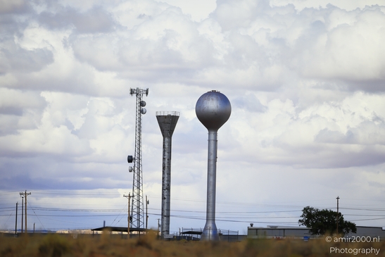 Towering Over The Desert in Arizona USA. A satellite dish stands tall in the desert, with a - image from year 2025 #003