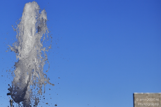 Water droplets spraying from a fountain in Outlet Spraying water droplets captured in motion with a image from year 2025 #3