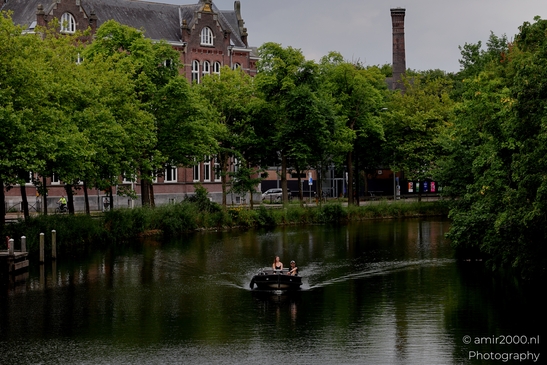 Boat_On_canal_Amsterdam_Netherlands_People_Creative_Collection_Photography_Canon_EOS_R5_Mark_II_2025_001.JPG