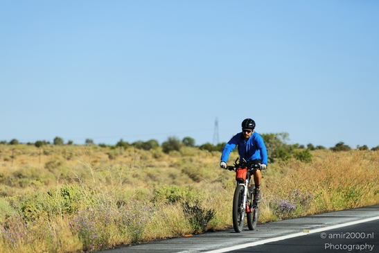 Cycling Adventure in Grand Canyon in Arizona USA. A cyclist rides through the desert landscape - image from year 2025 #003