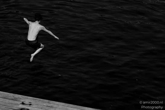 Jumping_to_the_canal_Black_and_White_series_Amsterdam_Netherlands_People_Creative_Collection_Photography_Canon_EOS_R5_Mark_II_2025_003.JPG