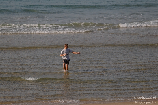 Man_Fishing_In_Shallow_Water_Tel_Aviv_Mediterranean_Sea_Israel_People_Creative_Collection_Photography_Canon_EOS_R5_Mark_II_2025_002.JPG