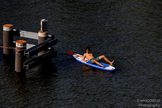 Man_Relaxing_On_Surfboard_summer_scenery_in_the_city_Amsterdam_Netherlands_People_Creative_Collection_Photography_Canon_EOS_R5_Mark_II_2025_001.JPG