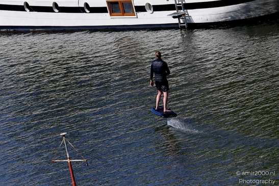 Man_Surfing_On_Paddleboard_in_the_Canal_Amsterdam_Netherlands_People_Creative_Collection_Photography_Canon_EOS_R5_Mark_II_2025_006.JPG