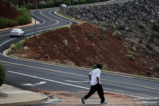 Man_Walking_On_Road_Near_Rocky_Hillside_St_George_Utah_People_Creative_Collection_Photography_Canon_EOS_R5_Mark_II_2025_001.JPG