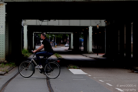 Riding_Under_Bridge_Amsterdam_Netherlands_People_Creative_Collection_Photography_Canon_EOS_R5_Mark_II_2025_001.JPG