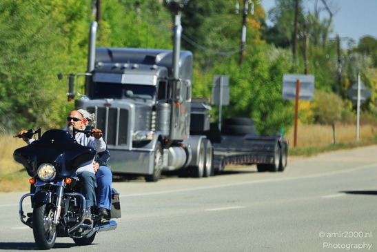 Man_Riding_Motorcycle_On_Highway_With_Trucks_Transportation_Collection_USA_Highway_and_Road_Scenes_Photography_Canon_EOS_R5_Mark_II_2025_001.JPG