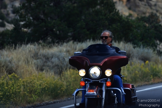 Man_riding_motorcycle_on_mountain_road_in_Colorado_Transportation_Collection_USA_Highway_and_Road_Scenes_Photography_Canon_EOS_R5_Mark_II_2025_001.JPG